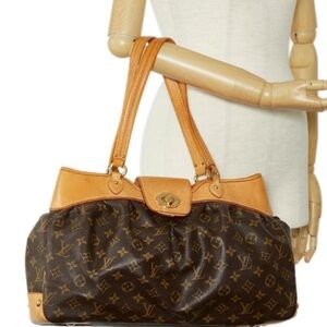 Lois Vuitton purse size L.  19 inch long about 9 inches high